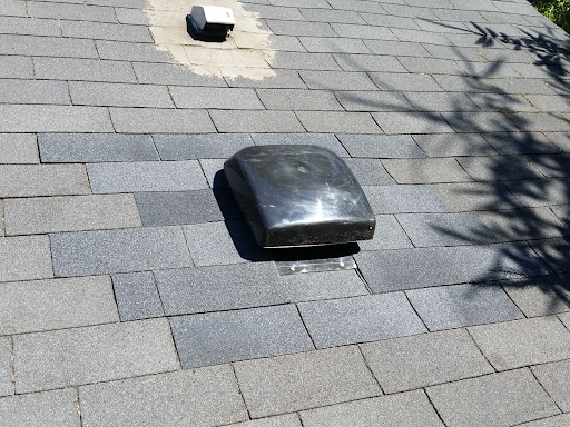 Flashing installed around a roof vent.