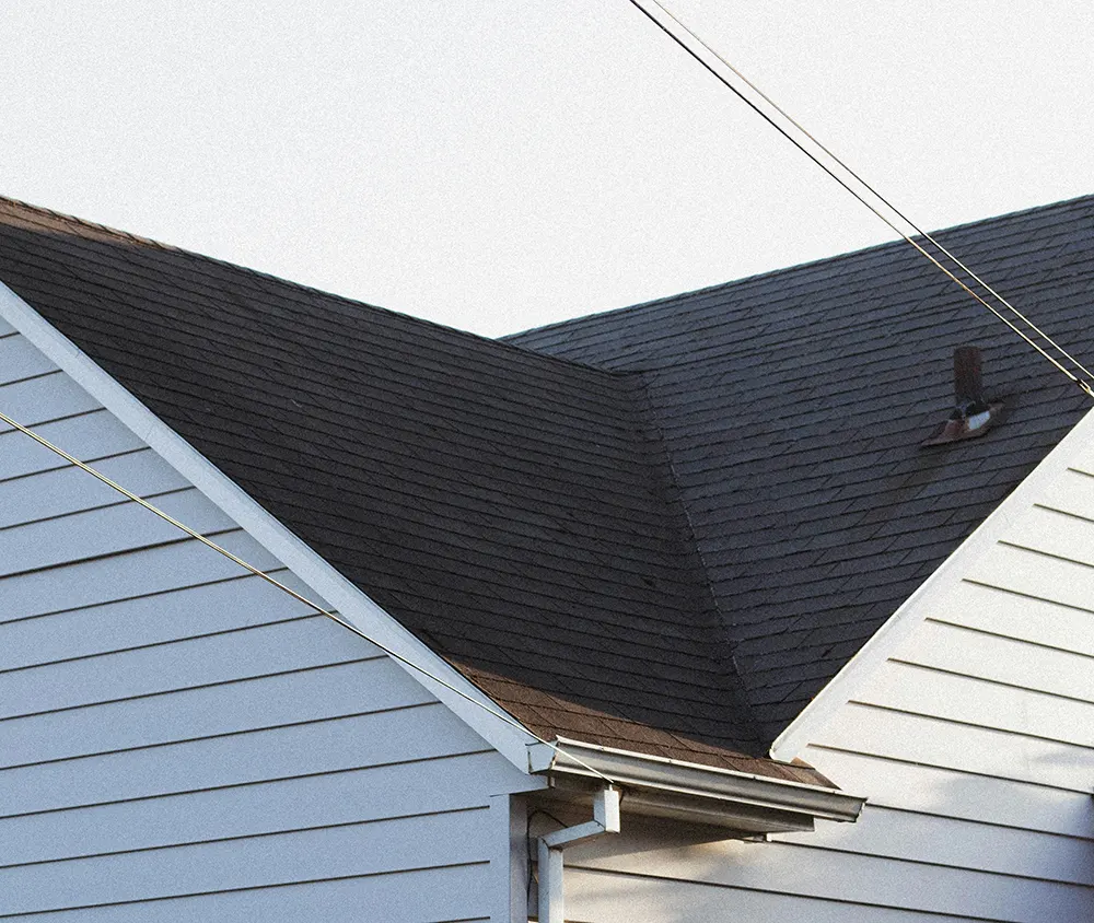 Shingle roof with vent and flashing