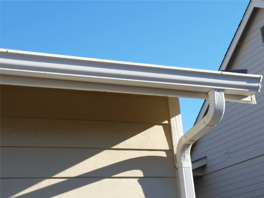 A newly installed white gutter